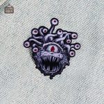 Pins Tyrannœil en design original et coloré