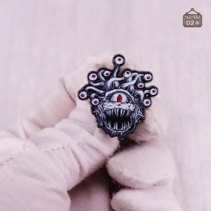 Épinglette Tyrannœil pour un look unique