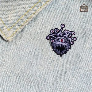 Pins créatifs Tyrannœil pour personnaliser vos vêtements