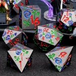 Dé de jeu en métal rose